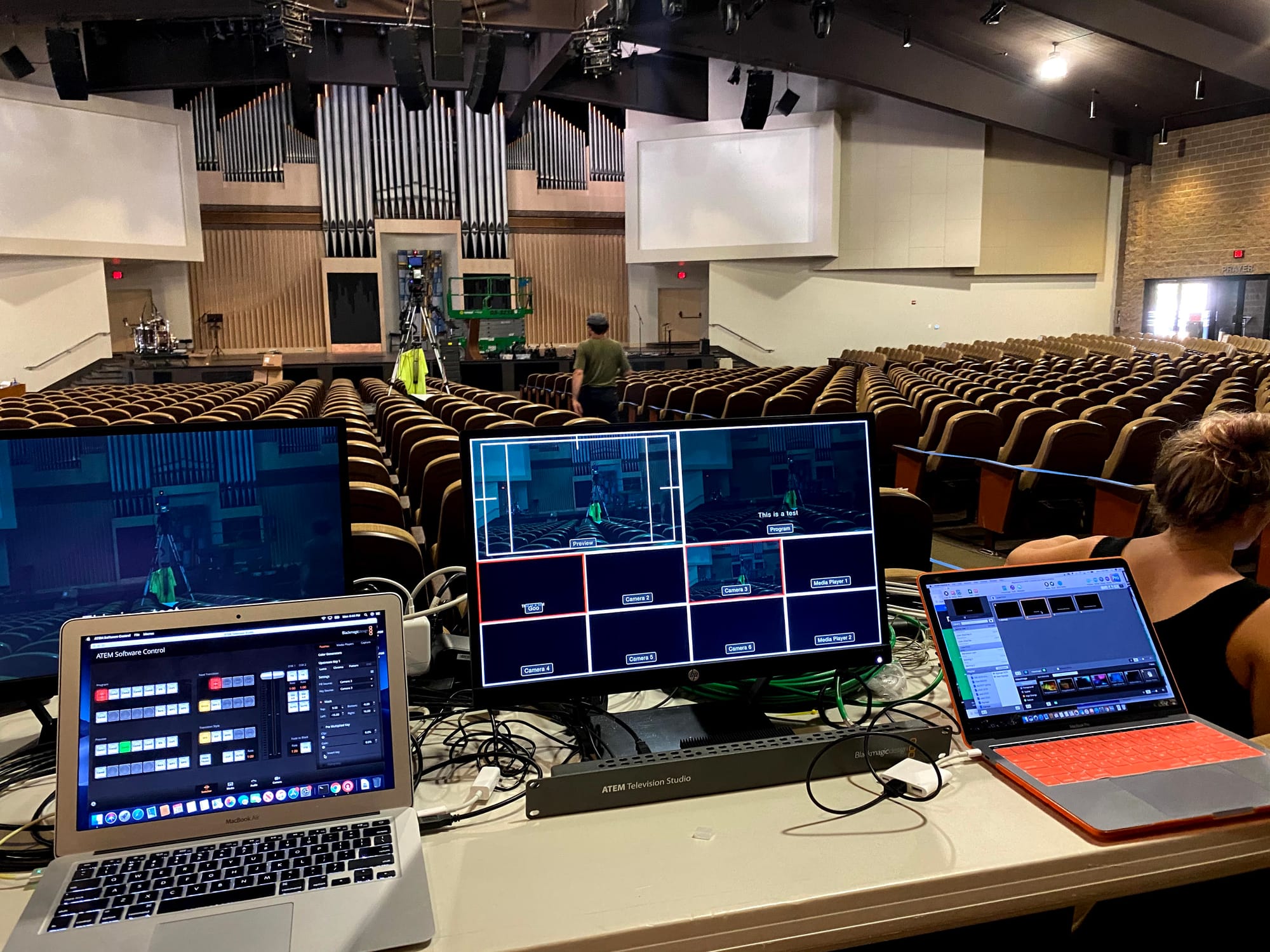 2 laptops on a bench connected to a Blackmagic ATEM TV Studio for testing